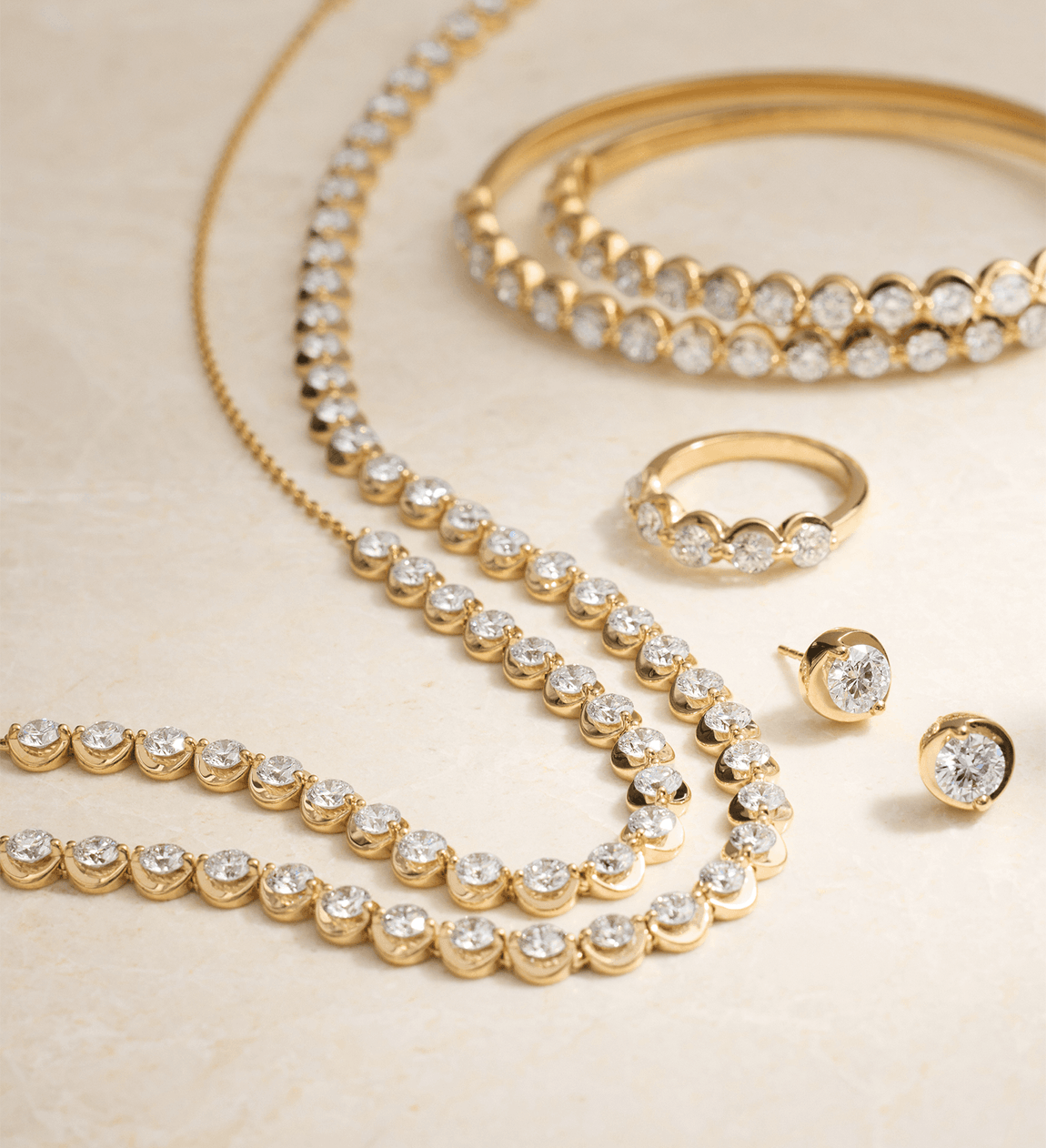 Blue Nile Illusion Collection diamond jewelry in yellow gold.